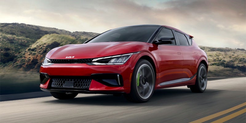 Red Kia EV6 in motion on the road