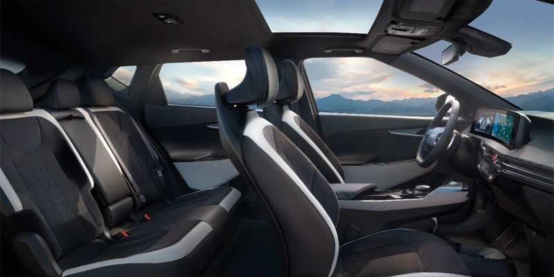 Kia EV6 interior with a focus on the front seats and steering wheel.
