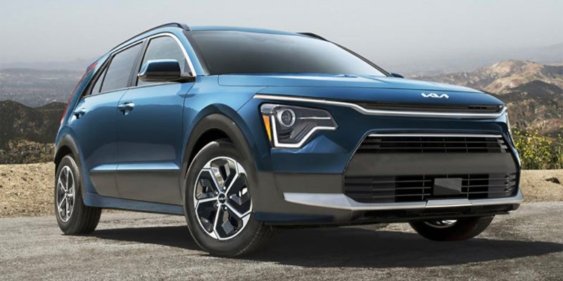 Kia Niro parked on rocky mountain trail